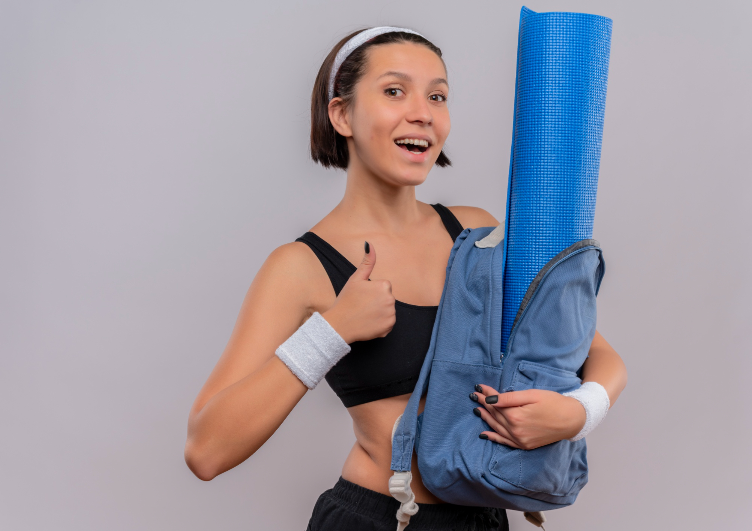 Smiling girl with a sport bag
