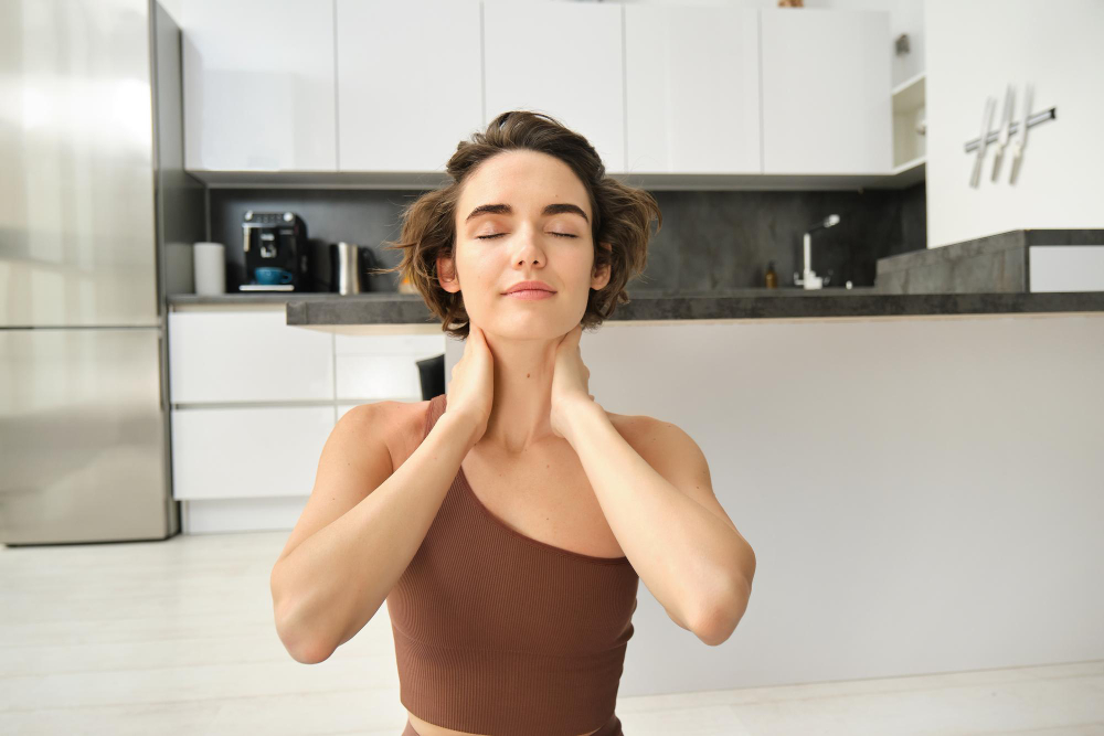 A girl does a neck exercise